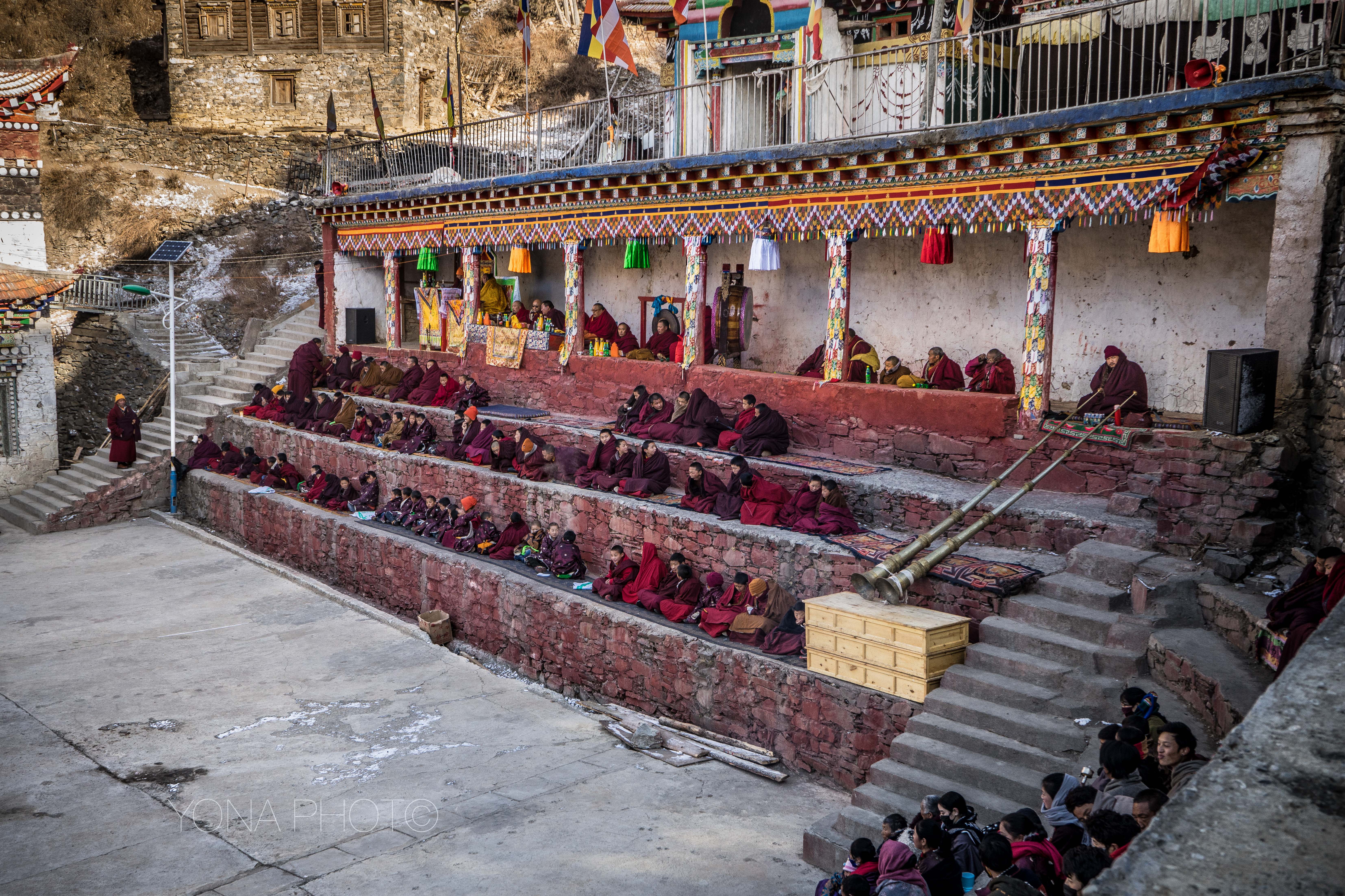 Monks await the entrance of the Dancers during Dharma Bliss Assembly festival